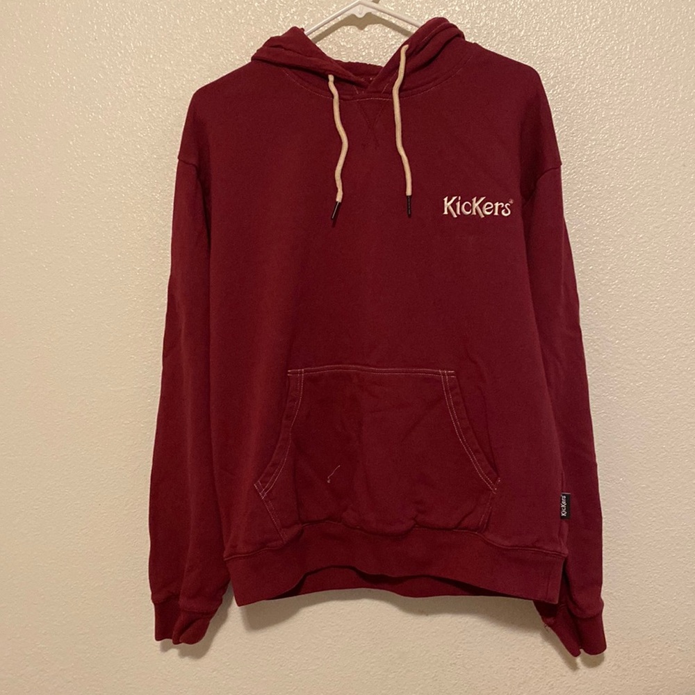 Burgundy color with logo on upper left chest and right side of hood